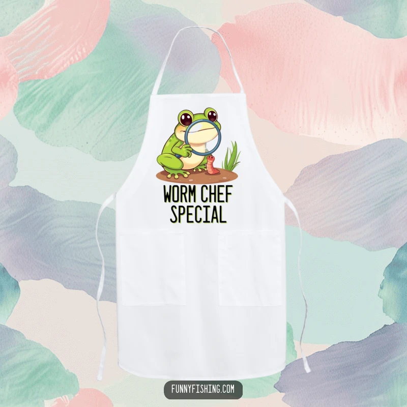 Funny frog chef apron featuring a cheerful frog with a magnifying glass focusing on a tiny, struggling worm, adding kitchen humor.