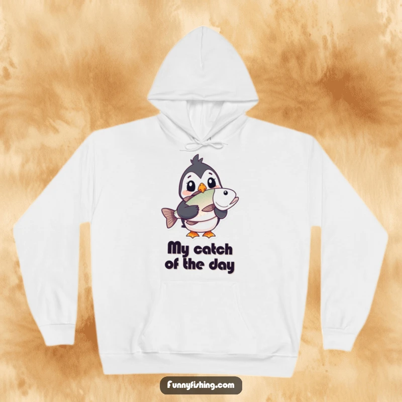 Funny puffin hoodie showing a startled puffin character triumphantly holding a huge fish, embodying comical shock and delight for cozy wear.