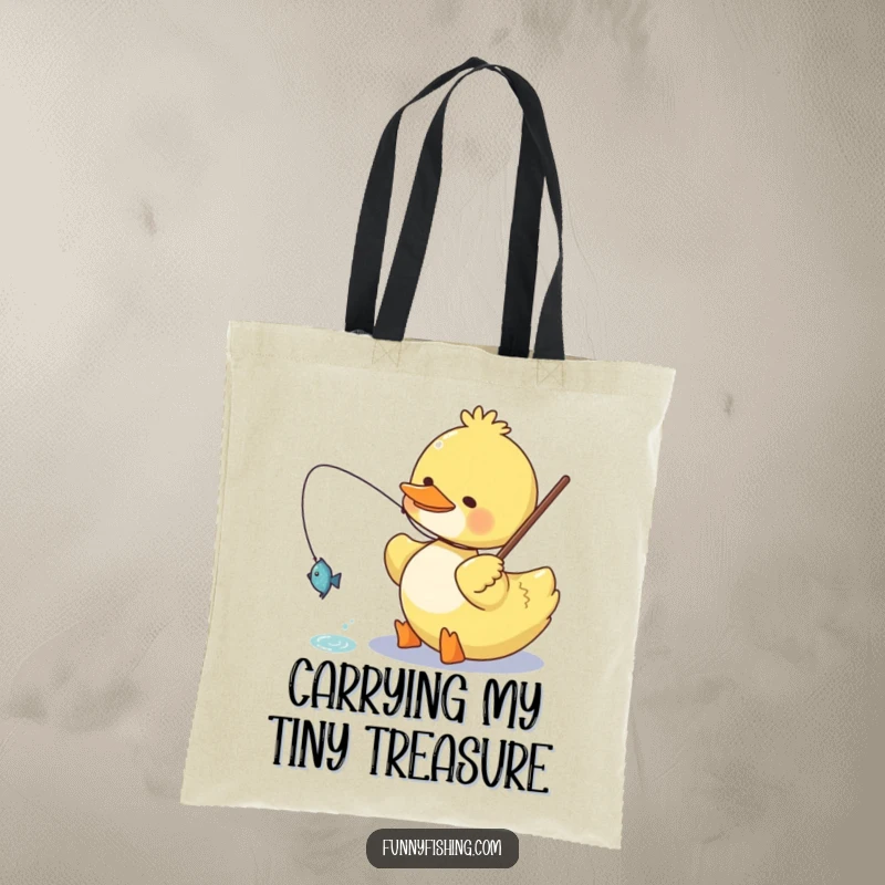 Funny duck tote bag showing a happy duck character reeling in a small, glittering fish, perfect for carrying essentials with a humorous touch.